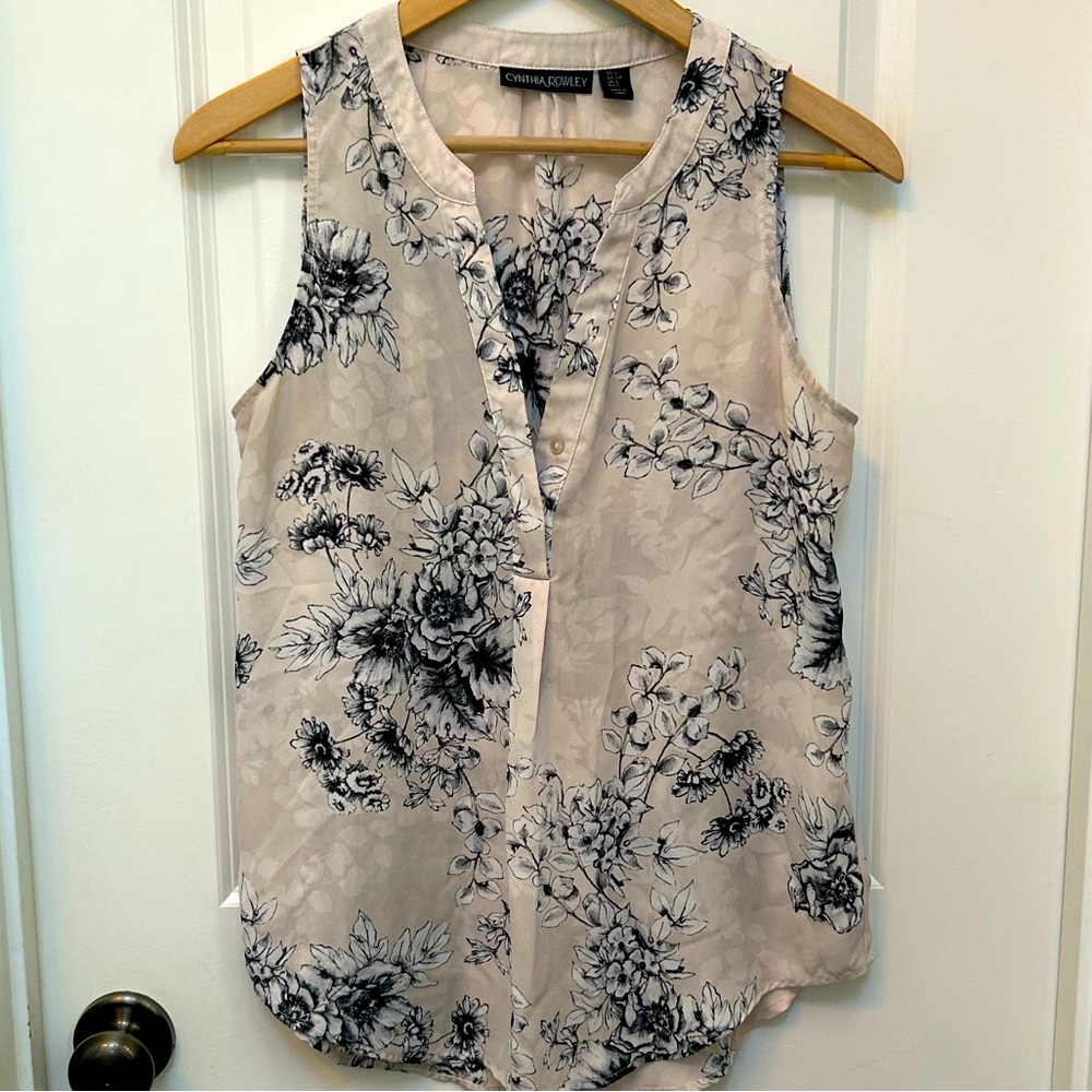 Pale pink sleeveless blouse